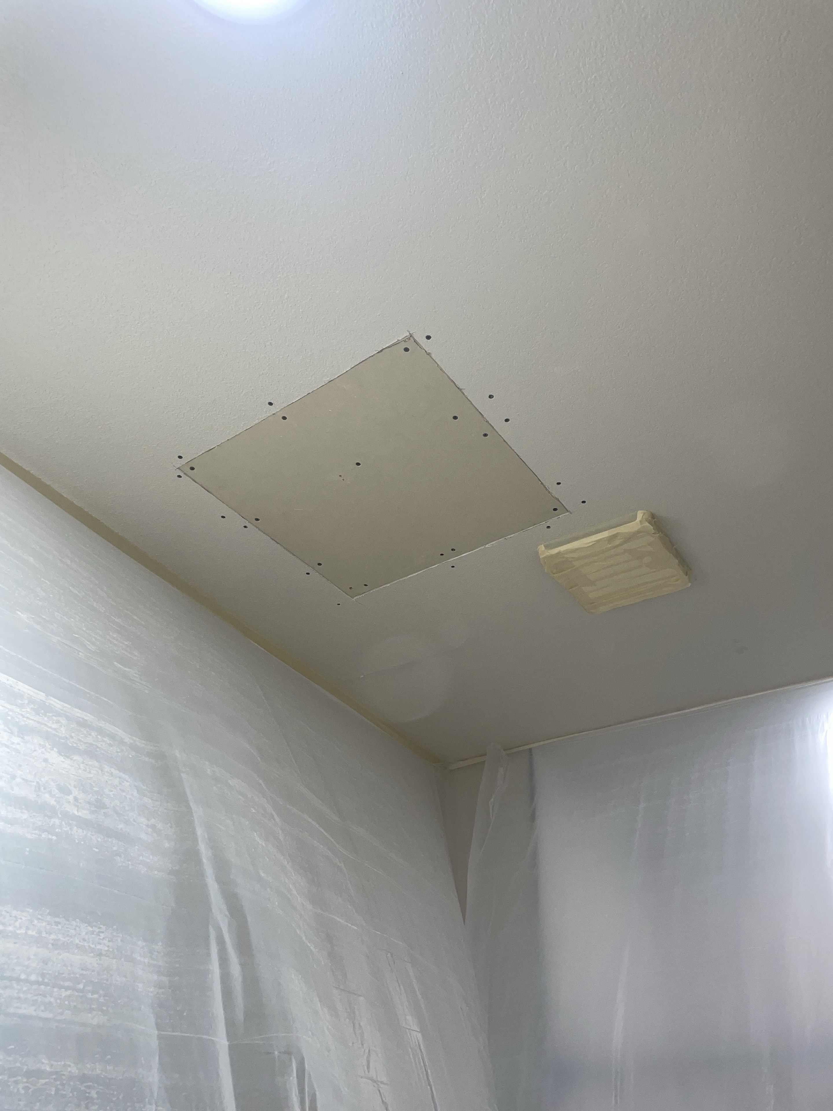 Drywall patch screwed in and ready for mud